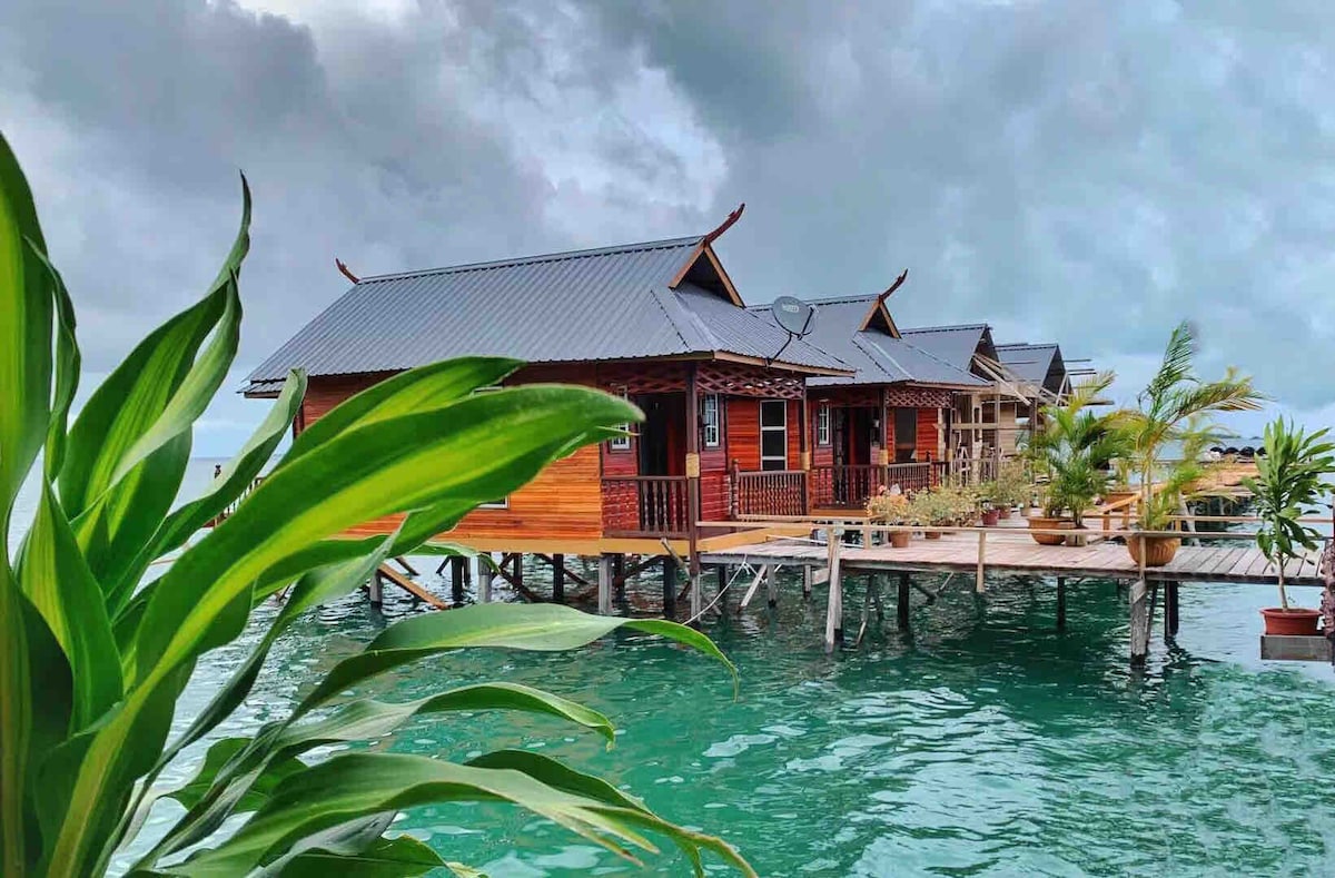 Stilt village walkway between homestay buildings